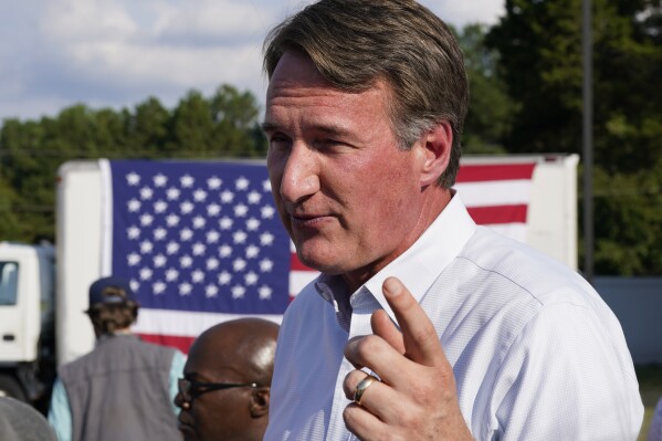 FILE - Virginia Gov. Glenn Youngkin addresses the crowd during an early voting rally Thursday Sep. 21, 2023, in Petersburg, Va. Two Virginia Beach parents have filed a lawsuit seeking to force their local school system to adopt Glenn Youngkin’s new model policies for the treatment of transgender students. (AP Photo/Steve Helber, File)