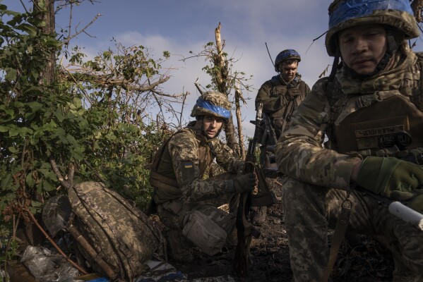 Ukrainian servicemen from the 3rd Assault Brigade at frontline positions near Andriivka, Donetsk region, Ukraine, Saturday, Sept. 16, 2023. Ukrainian brigade's two-month battle to fight its way through a charred forest shows the challenges of the country's counteroffensive in the east and south. (AP Photo/Mstyslav Chernov)