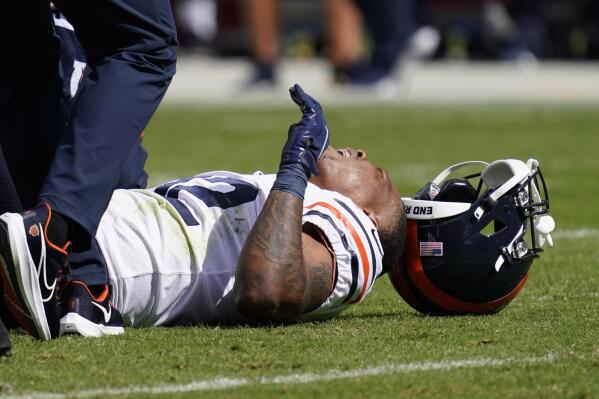 Chicago Bears running back David Montgomery reacts after being injured during the first half of an NFL football game against the Houston Texans Sunday, Sept. 25, 2022, in Chicago. (AP Photo/Nam Y. Huh)