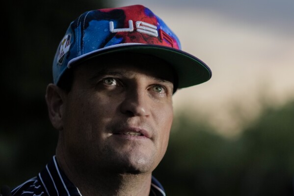 USA Ryder Cup team captain Zach Johnson talks to reporters as he returns with members of his team at a hotel in Rome, Friday, Sept. 8, 2023, at the end of a practice session at the Marco Simone golf club where the 2023 Ryder Cup will played starting next Sept. 29. (AP Photo/Andrew Medichini)