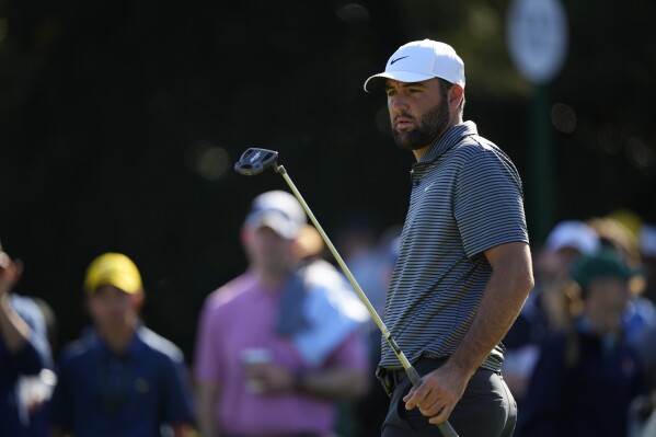 Scottie Scheffler putts during a practice round in preparation for the Masters golf tournament at Augusta National Golf Club Monday, April 8, 2024, in Augusta, Ga. (AP Photo/Matt Slocum)