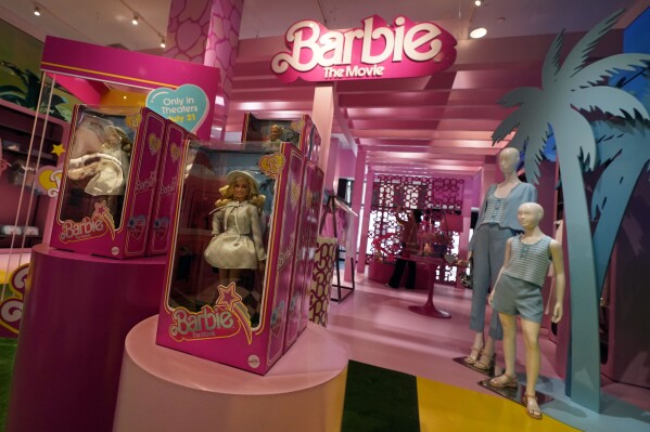 FILE - Barbie-themed merchandise is displayed in a special section at Bloomingdale's, in New York, Thursday, July 20, 2023. The "Barbie" movie, parent company Mattel, created a product marketing blitz with more than 100 brands plastering pink everywhere. (AP Photo/Richard Drew, File)