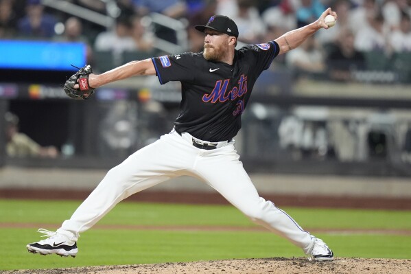 New York Mets' Jake Diekman pitches during the eighth inning of a baseball game against the Colorado Rockies, July 12, 2024, in New York. (AP Photo/Frank Franklin II, File)