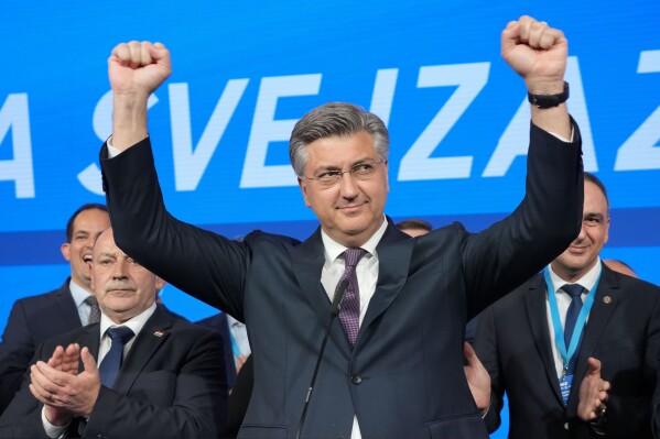 Prime Minister incumbent Andrej Plenkovic celebrates after claiming victory in a parliamentary election in Zagreb, Croatia, Thursday, April 18, 2024. Croatia's governing conservatives convincingly won a highly contested parliamentary election Wednesday, but will still need support from far-right groups to stay in power, according to the official vote count. The election followed a campaign that centered on a bitter rivalry between the country's president and prime minister. (AP Photo/Darko Vojinovic)