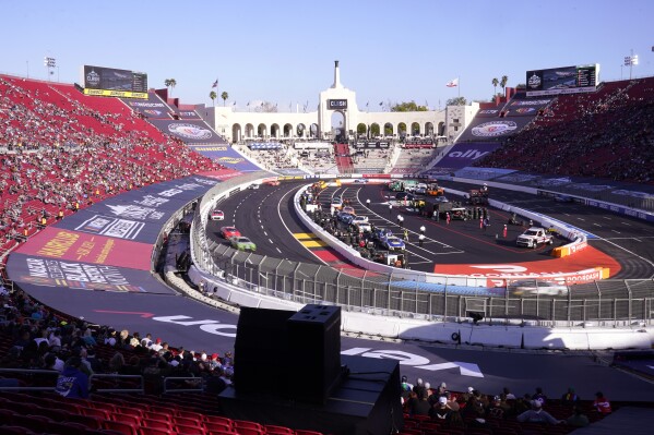 FILE - Cars race during the qualifying portion of the Busch Light Clash NASCAR exhibition auto race at Los Angeles Memorial Coliseum Sunday, Feb. 5, 2023, in Los Angeles. NASCAR returns to Los Angeles Memorial Coliseum for a third consecutive year for the exhibition Clash and the immediate future of racing in Southern California is at stake. (AP Photo/Mark J. Terrill, File)