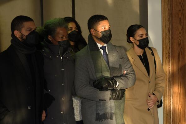 Actor Jussie Smollett, second from right, departs the Leighton Criminal Courthouse Wednesday, Dec. 8, 2021, with his mother, Janet, center, and unidentified siblings after Cook County Judge James Linn gave the case to the jury in Chicago. (AP Photo/Charles Rex Arbogast)