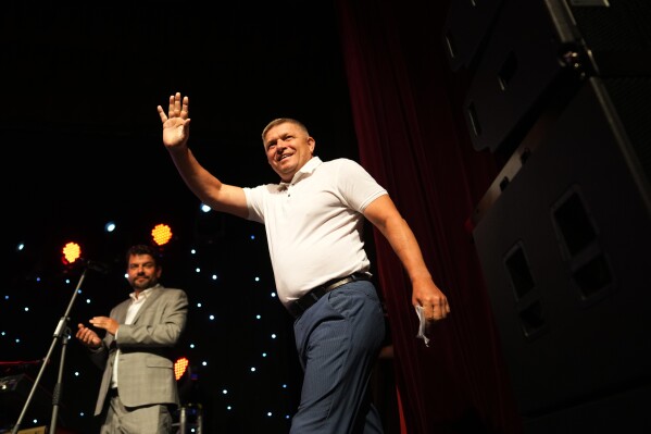 Former Slovak Prime Minister and head of leftist SMER - Social Democracy party, Robert Fico waves to his supporters during an election rally in Michalovce, Slovakia, Wednesday, Sept. 6, 2023. Fico, whose party is favored to win Slovakia’s early parliamentary election this month plans to reverse the country’s military and political support for neighboring Ukraine in a direct challenge to the European Union and NATO, if he returns to power. (AP Photo/Petr David Josek)