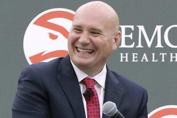 FILE - Atlanta Hawks general manager Travis Schlenk laughs during a press conference in Atlanta, May 14, 2018. Hawks president Travis Schlenk is stepping down and moving into an advisory position, the team said Wednesday, Dec. 21, 2022, while general manager Landry Fields will assume control of daily operations. (Curtis Compton/Atlanta Journal-Constitution via AP, File)