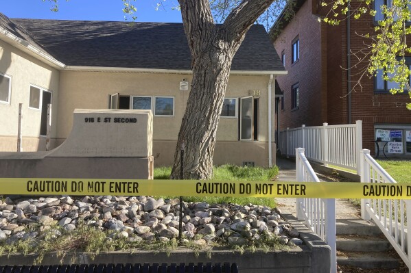 FILE - The fire-damaged Wellspring Health Access clinic is cordoned by tape, May 25, 2022, in Casper, Wyo. Lorna Roxanne Green, who says anxiety and nightmares led her to set fire to Wyoming’s only full-service abortion clinic is scheduled to be sentenced Thursday, Sept. 28, 2023. (AP Photo/Mead Gruver, File)