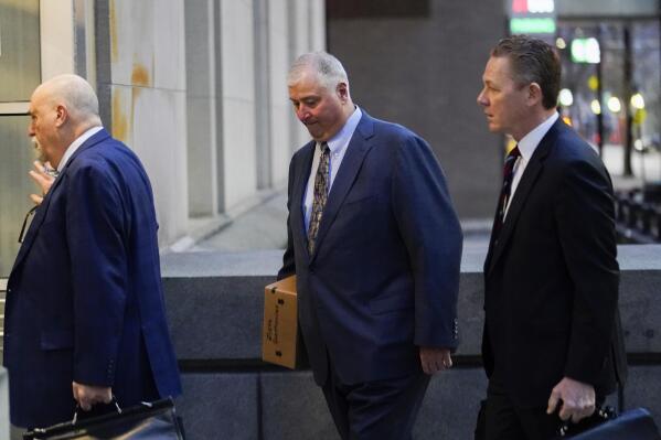FILE - Former Ohio House Speaker Larry Householder, center, walks into Potter Stewart U.S. Courthouse with his attorneys, Mark Marein, left, and Steven Bradley, right, before jury selection in his federal trial, Jan. 20, 2023, in Cincinnati, Ohio. Householder and former Ohio Republican Party Chair Matt Borges were convicted Thursday, March 9, 2023, in a $60 million bribery scheme that federal prosecutors have called the largest corruption case in state history. (AP Photo/Joshua A. Bickel, File)
