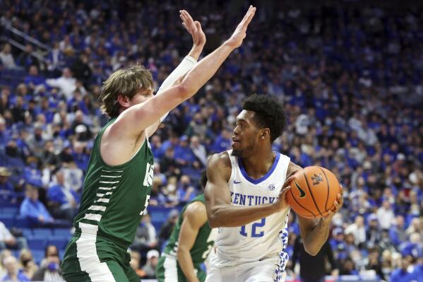 Kentucky's Keion Brooks Jr. (12) is pressured Ohio's Ben Vander Plas (5) during the first half of an NCAA college basketball game in Lexington, Ky., Friday, Nov. 19, 2021. (AP Photo/James Crisp)