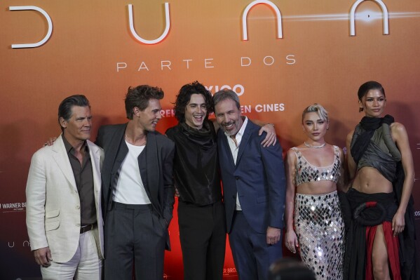 From left to right, Josh Brolin, Austin Butler, Timothee Chalamet, Denis Villeneuve, Florence Pugh and Zendaya pose for the photographers during the photo call promoting the film "Dune: Part Two" in Mexico City, Monday, Feb. 5, 2024. (AP Photo/Marco Ugarte)