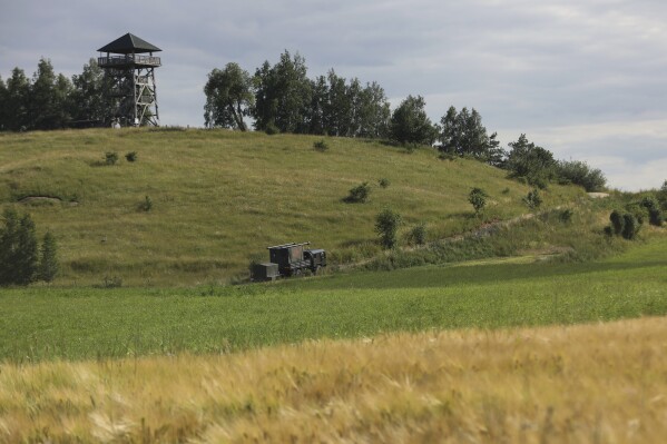 FILE - A military truck drives up the hill in Baranowo, Poland, Thursday, July 7, 2022. The Suwalki gap, which stretches about 100 kilometres along the Lithuanian-Polish border and lies sandwiched between Belarus and the Russian exclave of Kaliningrad, has long been regarded as a vulnerable point in Nato's defences, if a conflict breaks out with Russia. NATO allies located along the alliance’s eastern front are growing increasingly worried about the presence of Russia-linked Wagner group mercenaries in Belarus. (AP Photo/Michal Dyjuk, File)