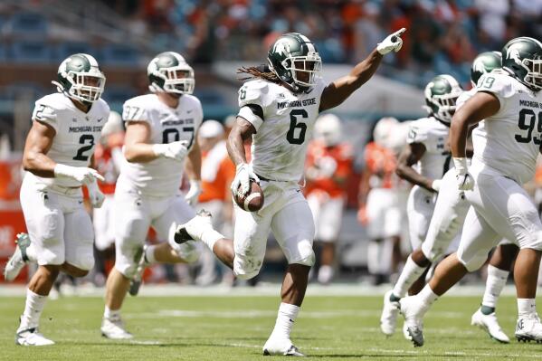 Michigan State linebacker Quavaris Crouch (6) celebrates after recovering a fumble during the first quarter of an NCAA college football game against Miami, Saturday, Sept. 18, 2021, in Miami Gardens, Fla. (AP Photo/Michael Reaves)