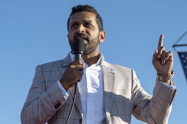 FILE - Kash Patel speaks at a rally in Minden, Nev., Oct. 8, 2022. Patel, said Tuesday, Dec. 5, 2023, that if the former president is elected again, his administration will retaliate against people in the media "criminally or civilly." Patel said on Steve Bannon's podcast that a future administration would "go out and find the conspirators not just in government, but in the media" over the 2020 presidential election. (AP Photo/José Luis Villegas, File)