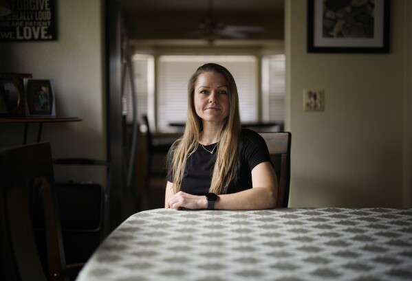 Rebecca Leavitt poses for a portrait at her home, April 8, 2024, in Las Vegas.  (AP Photo/John Locher)