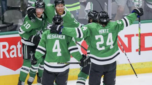Dallas Stars, including Ty Dellandrea (10), Miro Heiskanen (4) and Roope Hintz (24) celebrate with Joe Pavelski (16) after his overtime goal against the Vegas Golden Knights in Game 4 of the NHL hockey Stanley Cup Western Conference finals Thursday, May 25, 2023, in Dallas. (AP Photo/Gareth Patterson)