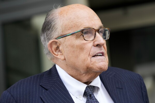 FILE - Rudy Giuliani speaks with reporters as he departs the federal courthouse, May 19, 2023, in Washington. (AP Photo/Patrick Semansky, File)