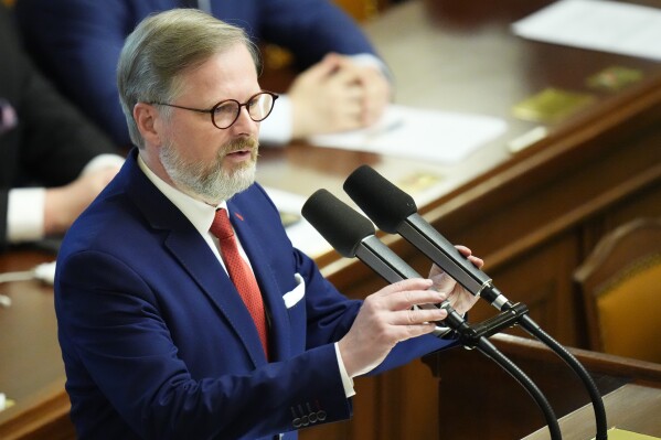 FILE - Czech Republic's Prime Minister Petr Fiala delivers a speech at the Parliament in Prague, Czech Republic, Wednesday, June 15, 2022. The Czech parliament’s lower house on Friday, Oct. 13, 2023 approved dozens of measures proposed by the government designed to keep the ballooning budget deficit under control. In the 200-seat house, 108 lawmakers from the ruling coalition voted in favor of the plan, while 86 opposition members were against. (AP Photo/Petr David Josek/File)
