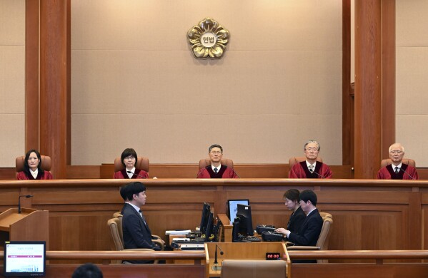 Moon Hyung-bae, acting chief justice of South Korea's Constitutional Court, presides over the impeachment verdict for South Korean Prime Minister Han Duck-soo at the Constitutional Court in Seoul Monday, March 24, 2025. (Kim Min-Hee/Pool Photo via AP)