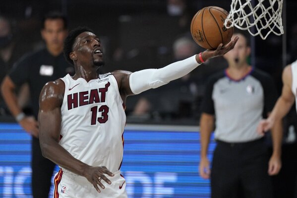 Miami Heat's Bam Adebayo (13) goes up for a layup during the first half of an NBA conference final playoff basketball game against the Boston Celtics on Tuesday, Sept. 15, 2020, in Lake Buena Vista, Fla. (AP Photo/Mark J. Terrill)
