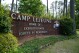 FILE - Signage stands on the main gate to Camp Lejeune Marine Base outside Jacksonville, N.C., April 29, 2022. Military personnel stationed at Camp Lejeune from 1975 to 1985 had at least a 20% higher risk for a number of cancers than those stationed elsewhere, federal health officials said Wednesday, Jan. 31, 2024 in a long-awaited study of the North Carolina base's contaminated drinking water. (APPhoto/Allen G. Breed, File)