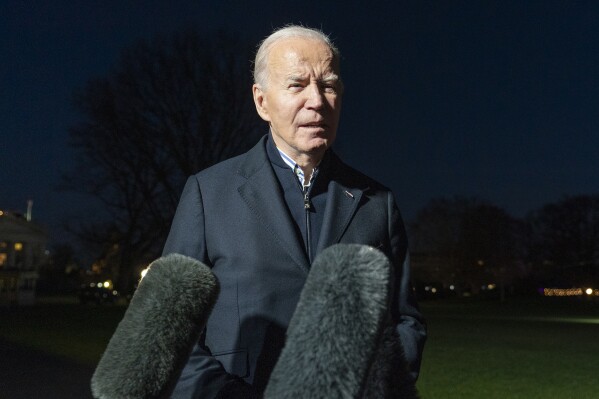 FILE - President Joe Biden answers a reporter's question as he walks from Marine One upon arrival on the South Lawn of the White House, Dec. 20, 2023, in Washington. The United States, key allies and Arab nations engaged in high-level diplomacy in hopes of avoiding another U.S. veto of a new U.N. resolution on desperately needed aid to Gaza ahead of a long-delayed vote now scheduled for Thursday morning, Dec. 21, 2023. (AP Photo/Alex Brandon, File)