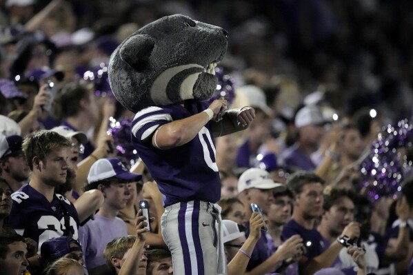 Kansas State mascot Willie the Wildcat dances with the crowd during the second half of an NCAA college football game against Southeast Missouri State Saturday, Sept. 2, 2023, in Manhattan, Kan. (AP Photo/Charlie Riedel)