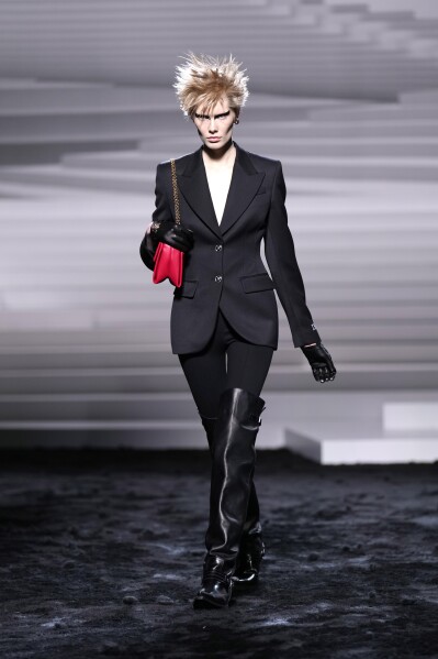 A model wears a creation as part of the Versace women's Fall-Winter 2024-25 collection presented in Milan, Italy, Friday, Feb. 23, 2024. (AP Photo/Antonio Calanni)