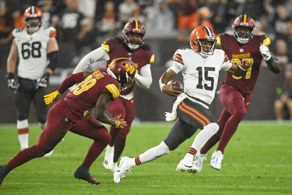 Cleveland Browns quarterback Joshua Dobbs runs against the Washington Commanders during the first half of a preseason NFL football game on Friday, Aug. 11, 2023, in Cleveland. (AP Photo/David Richard)
