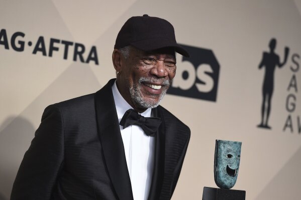 
              Morgan Freeman poses with his Life Achievement Award in the press room at the 24th annual Screen Actors Guild Awards at the Shrine Auditorium & Expo Hall on Sunday, Jan. 21, 2018, in Los Angeles. (Photo by Jordan Strauss/Invision/AP)
            