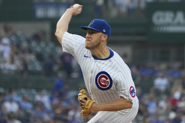 Chicago Cubs starting pitcher Jameson Taillon throws to a Cincinnati Reds batter during the first inning of a baseball game in Chicago, Thursday, Aug. 3, 2023. (AP Photo/Nam Y. Huh)