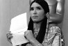 A woman in Native American Indian dress, who indentified herself as Sacheen Littlefeather, tells the audience at the Academy Awards ceremony in Los Angeles March 27, 1973, that Marlon Brando was declining to accept his Oscar as best actor for his role in "The Godfather."  Littlefeather said Brando was protesting "the treatment of the American Indian in motion pictures and on televison, and because of the recent events at Wounded Knee."  (AP Photo)