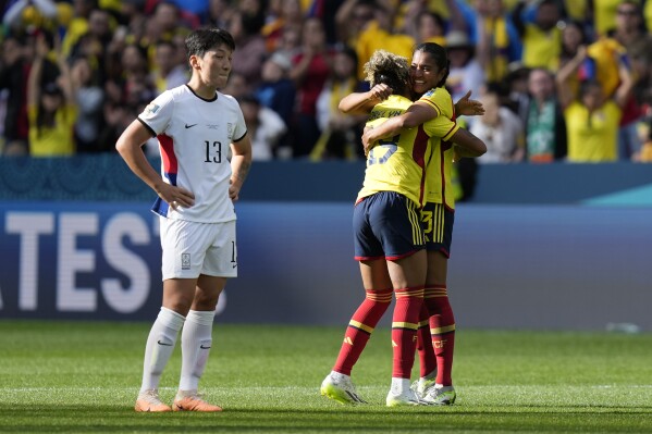 South Korea's Park Eun-sun, stands on the pitch as Colombia's players celebrate at the end of the Women's World Cup Group H soccer match between Colombia and South Korea at the Sydney Football Stadium in Sydney, Australia, Tuesday, July 25, 2023. (AP Photo/Rick Rycroft)