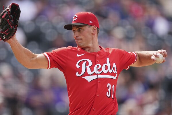 Cincinnati Reds relief pitcher Brent Suter works against the Colorado Rockies in the ninth inning of a baseball game Sunday, April 27, 2025, in Denver. (AP Photo/David Zalubowski)