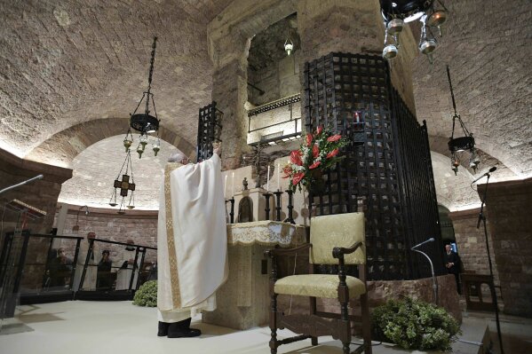 Pope Francis celebrates Mass in the crypt of the Basilica of St. Francis, in Assisi, Italy, Saturday, Oct. 3, 2020. Pope Francis travelled to the homeland of his nature-loving namesake on Saturday to sign an encyclical laying out his vision of a post-COVID world built on solidarity, fraternity and care for the environment.
In his first outing from Rome since the coronavirus lockdown, Francis celebrated Mass on Saturday in the crypt of the Basilica of St. Francis in the Umbrian hilltop town of Assisi. (Vatican Media via AP)