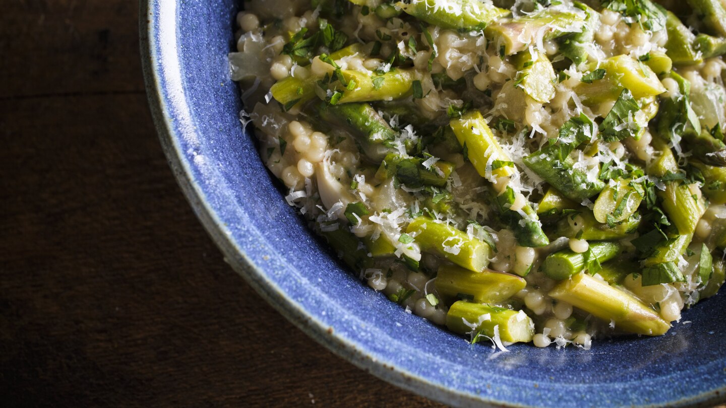 Couscous gets the risotto treatment in this creamy springtime recipe