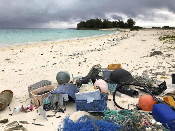 FILE - In this Oct. 22, 2019, photo, plastic and other debris is seen on the beach on Midway Atoll in the Northwestern Hawaiian Islands. America needs to rethink and reduce the way it generates plastics because so much of it is littering the oceans, the National Academy of Sciences recommends in a new report, Wednesday, Dec. 1, 2021. (AP Photo/Caleb Jones, File)
