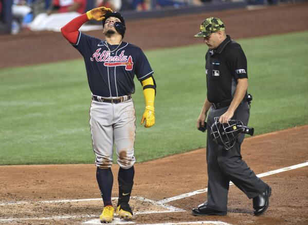 Photos: Braves break out red uniforms, beat Marlins