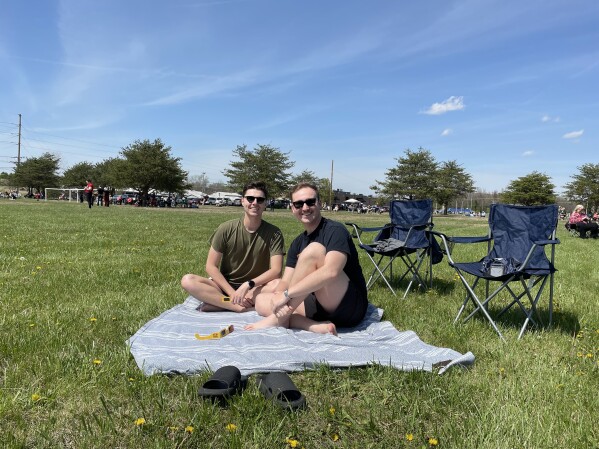 Colby Reed, right, and Adam Johnston came from Nashville to Scottsburg, Indiana, for the eclipse. (AP Photo/Laura Ungar)
