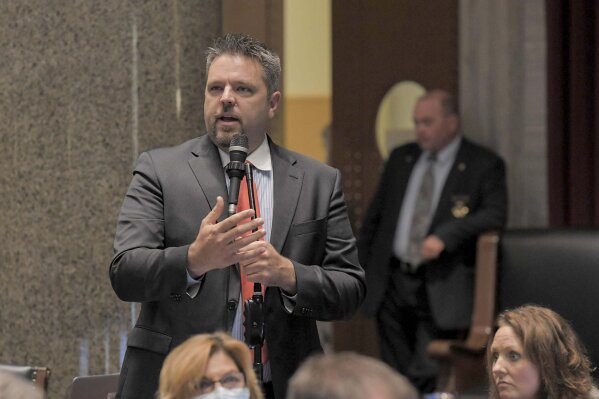 In this photo provided by the Missouri House of Representatives, Missouri state Rep. Justin Hill speaks on the Missouri House floor during debate on May 13, 2020, in Jefferson City, Mo. Hill, who won re-election, skipped his own inaugural ceremonies on Wednesday, Jan. 6, 2021, at the Missouri Capitol to instead attend a rally with President Donald Trump in the nation's capital. Hill traveled to Washington to encourage Congress not to accept the electoral college votes for President-elect Joe Biden from several states. (Tim Bommel/Missouri House of Representatives via AP)