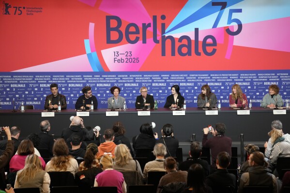 The Film Festival, Berlinale International Jury from left, Nabil Ayouch, Rodrigo Moreno, Maria Schrader, Todd Haynes, Fan Bingbing, Bina Daigeler, Amy Nicholson and the festival Director Tricia Tuttle attend a news conference at the opening day of International Film Festival, Berlinale, in Berlin, Thursday, Feb. 13, 2025. (AP Photo/Ebrahim Noroozi)