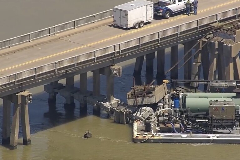 Oil spills into the surrounding waters after a barge hit a bridge in Galveston, Texas, on Wednesday, May 15, 2024. A bridge that leads to Pelican Island, located just north of Galveston, was hit by a barge around 9:30 a.m., said Ronnie Varela, with the Galveston’s Office of Emergency Management.(KTRK via AP)