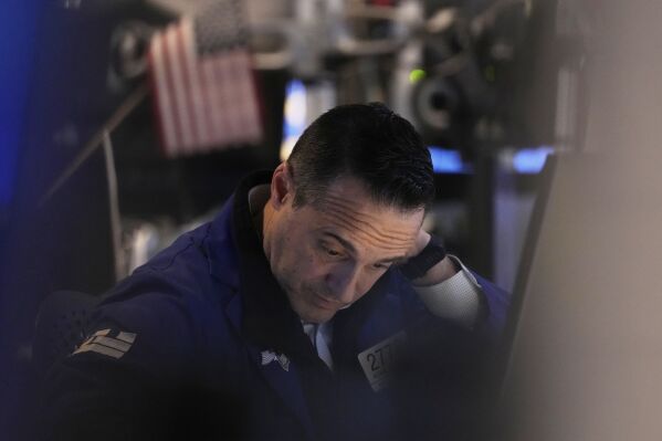 Specialist Michael Gagliano works at his post on the floor of the New York Stock Exchange, Thursday, April 10, 2025. (AP Photo/Richard Drew)