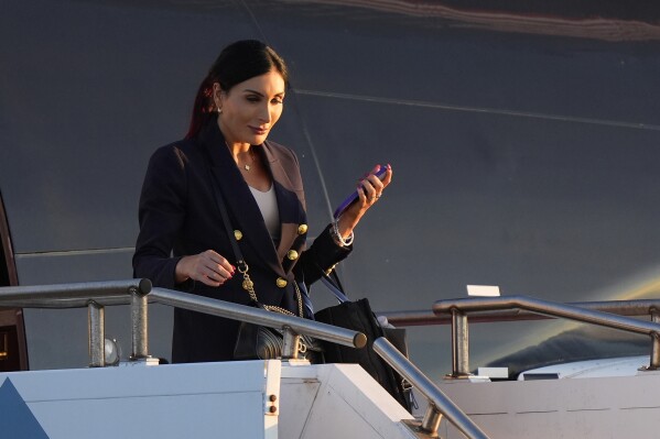 Laura Loomer arrives with Republican presidential nominee former President Donald Trump at Philadelphia International Airport, Sept. 10, 2024, in Philadelphia. (AP Photo/Chris Szagola, File)