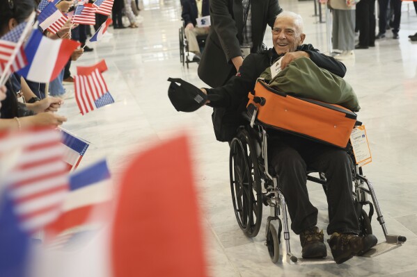 American D-Day veteran Anthony Pagano arrives at Charles de Gaulle airport, Saturday, June 1, 2024 in Roissy, north of Paris. More than sixty American veterans arrive for ceremonies marking D-Day 80th anniversary. (AP Photo/Thomas Padilla)