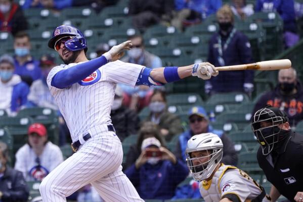 Chicago Cubs player Kris Bryant holds his glove while giving a