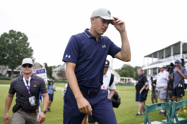 Jordan Spieth walks off the 18th hole after finishing the first round of the FedEx St. Jude Championship golf tournament at TPC Southwind in Memphis, Tenn., Thursday, Aug. 10, 2023. (Chris Day/The Commercial Appeal via AP)