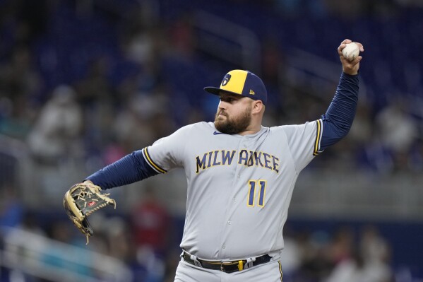 FILE- Milwaukee Brewers first baseman Rowdy Tellez pitches during the ninth inning of a baseball game against the Miami Marlins, Sept. 22, 2023, in Miami. Tellez signed a one-year deal with the Pittsburgh Pirates on Tuesday, Dec. 12, 2023, to fill a void at first base. (AP Photo/Wilfredo Lee, File)