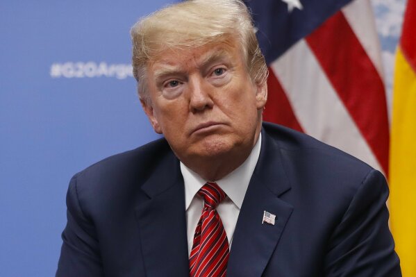 
              President Donald Trump listens to questions from members of the media during his meeting with Germany's Chancellor Angela Merkel at the G20 Summit, Saturday, Dec. 1, 2018 in Buenos Aires, Argentina. (AP Photo/Pablo Martinez Monsivais)
            